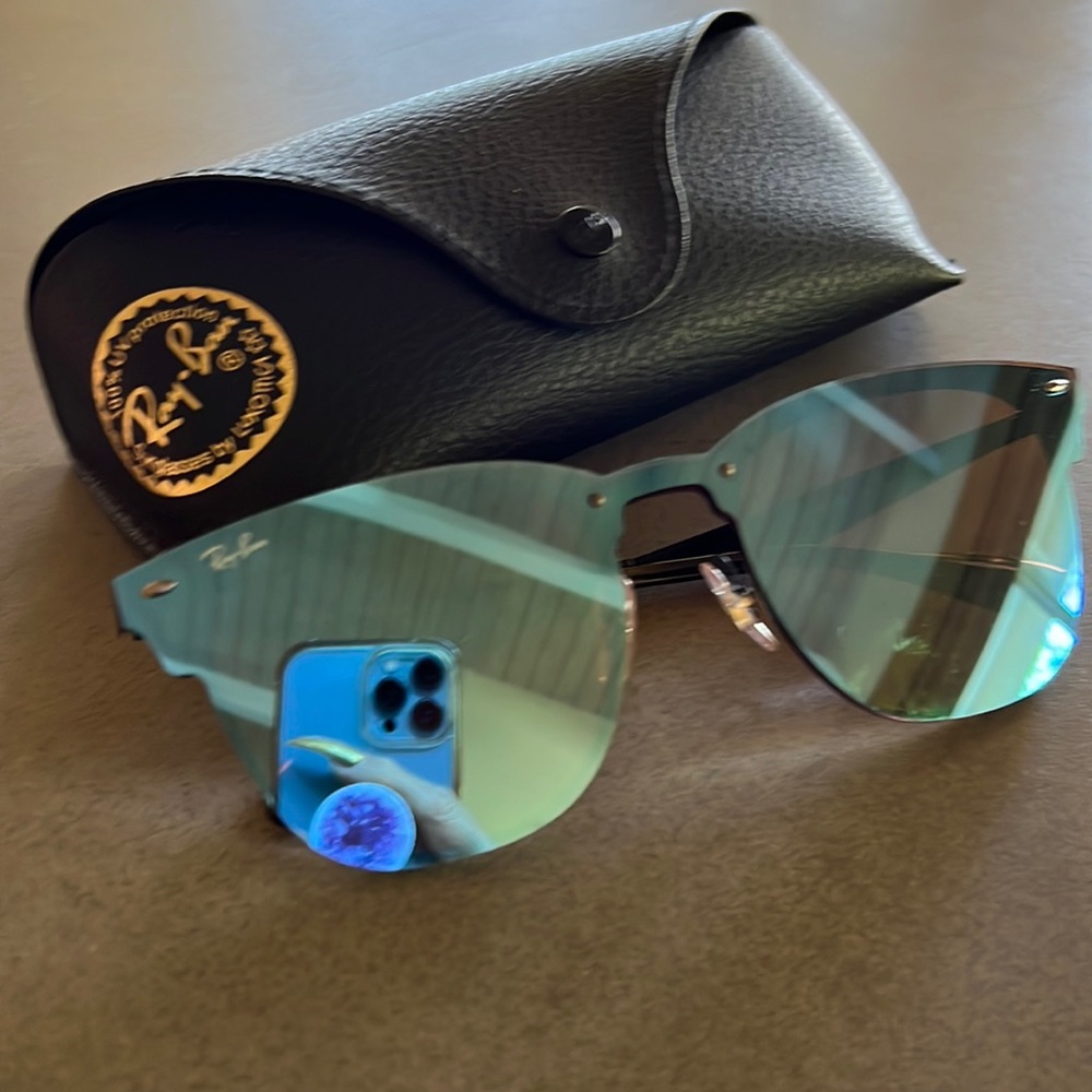Rayban blue mirrored lens black sunglasses. Beautiful slightly cat eye shape.